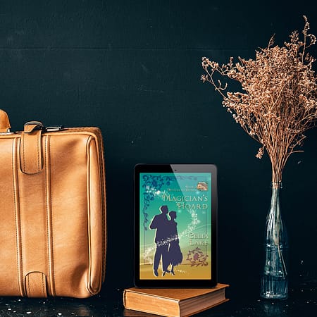 Cover of Magician's Hoard displayed on a tablet between a pale leather satchel and some decorative golden grass in a vase.