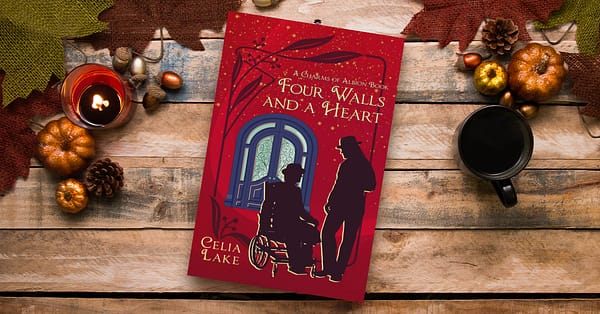 Four Walls and a Heart lying on a table with autumn gourds. The cover is a deep red, with a man in a wheelchair and a man standing, both in silhouette, in front of a large blue and glass door.